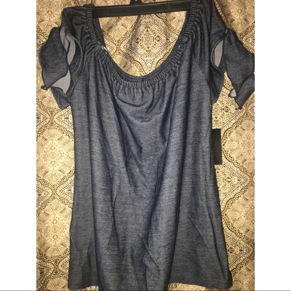 Off the shoulder top with cute shoulder detail.
